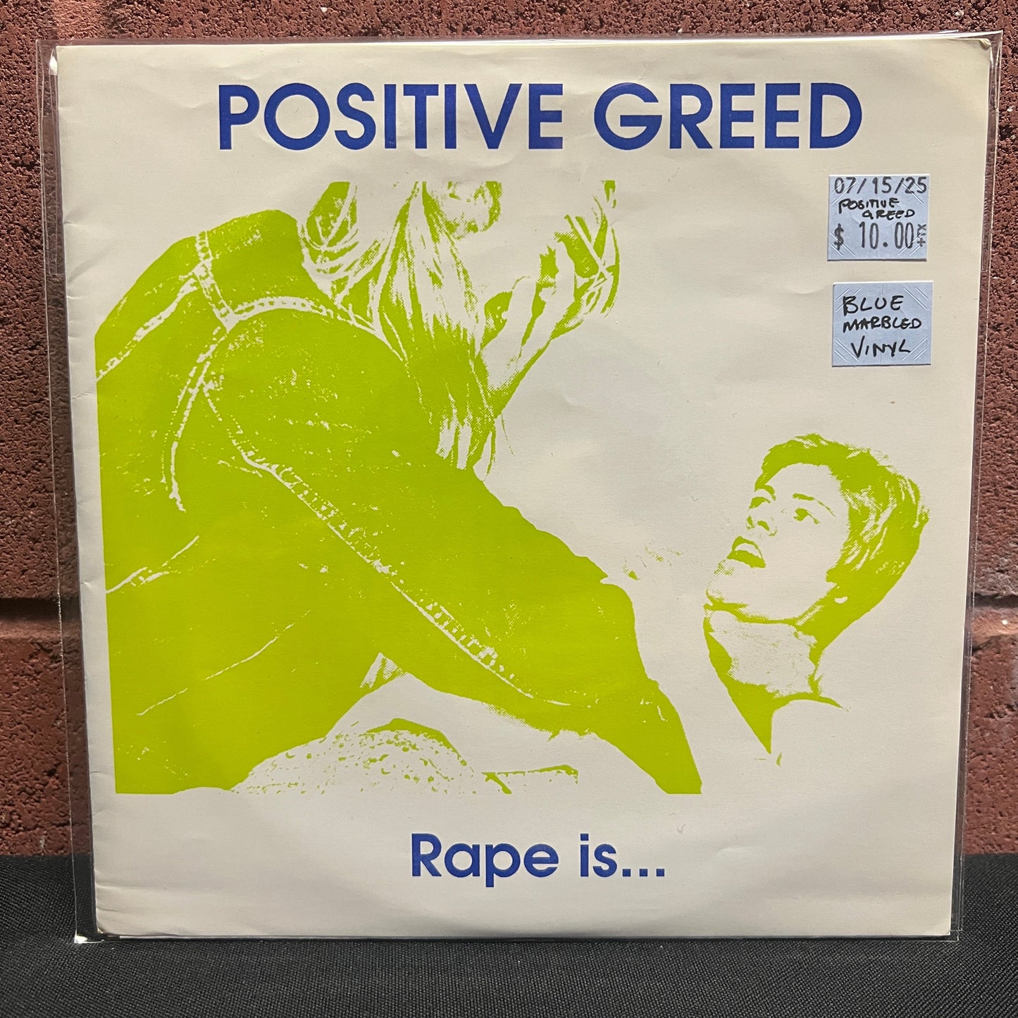 Used Vinyl: Positive Greed "Rape Is..." 7" (Blue Marbled vinyl)